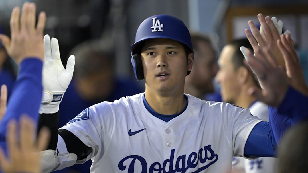 Apr 16, 2025; Los Angeles, California, USA; Los Angeles Dodgers designated hitter Shohei Ohtani (17) is congratulated after a solo home run in the first inning against the Colorado Rockies at Dodger Stadium. Mandatory Credit: Jayne Kamin-Oncea-Imagn Images Apr 16, 2025; Los Angeles, California, USA; Los Angeles Dodgers designated hitter Shohei Ohtani (17) is congratulated after a solo home run in the first inning against the Colorado Rockies at Dodger Stadium. Mandatory Credit: Jayne Kamin-Oncea-Imagn Images