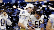Jan 2, 2025; New Orleans, LA, USA; Notre Dame Fighting Irish quarterback Riley Leonard (13) celebrates the win against Georgia Bulldogs at Caesars Superdome. 