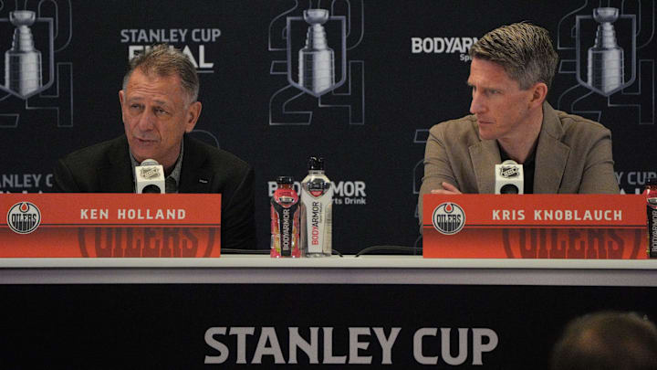 Jun 7, 2024; Sunrise, Florida, USA; Edmonton Oilers general manager Ken Holland, left, and head coach Kris Knoblauch take questions during media day in advance of the 2024 Stanley Cup Final at Amerant Bank Arena. Mandatory Credit: Jim Rassol-Imagn Images Jun 7, 2024; Sunrise, Florida, USA; Edmonton Oilers general manager Ken Holland, left, and head coach Kris Knoblauch take questions during media day in advance of the 2024 Stanley Cup Final at Amerant Bank Arena. Mandatory Credit: Jim Rassol-Imagn Images