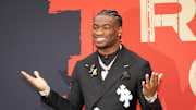 Alabama Crimson Tide quarterback Jalen Milroe on the red carpet before the NFL Draft at Lambeau Field.