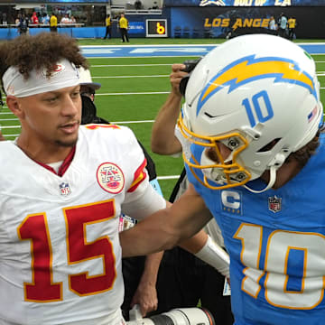 Sep 29, 2024; Inglewood, California, USA; Kansas City Chiefs quarterback Patrick Mahomes (15) and Los Angeles Chargers quarterback Justin Herbert (10) shake hands after the game at SoFi Stadium. Mandatory Credit: Kirby Lee-Imagn Images