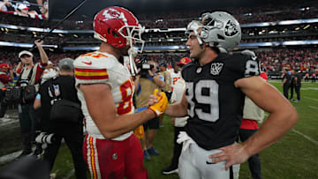 Oct 27, 2024; Paradise, Nevada, USA; Kansas City Chiefs tight end Travis Kelce (87) and Las Vegas Raiders tight end Brock Bowers (89) interact after the game at Allegiant Stadium. Mandatory Credit: Kirby Lee-Imagn Images