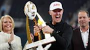 Dec 27, 2024; Las Vegas, NV, USA; Southern California Trojans head coach Lincoln Riley holds the championship trophy after the game against the Texas A&M Aggies at Allegiant Stadium. Mandatory Credit: Kirby Lee-Imagn Images