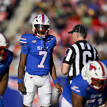 Nov 30, 2024; Dallas, Texas, USA; Southern Methodist Mustangs quarterback Kevin Jennings (7) in action during the game between the SMU Mustangs and the California Golden Bears at Gerald J. Ford Stadium. Mandatory Credit: Jerome Miron-Imagn Images