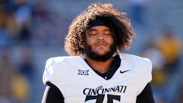 Nov 18, 2023; Morgantown, West Virginia, USA; Cincinnati Bearcats offensive lineman John Williams (75) prepares before a game against West Virginia Mountaineers at Milan Puskar Stadium.  Mandatory Credit: Kareem Elgazzar-Imagn Images