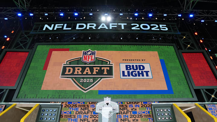 The Green Bay 2025 logo on the main stage before the NFL Draft at Lambeau Field. The Green Bay 2025 logo on the main stage before the NFL Draft at Lambeau Field.