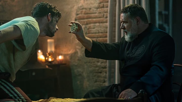 Father Gabriele Amorth (Russell Crowe, right) in The Pope's Exorcist